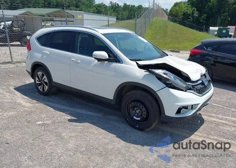 2016 Honda Cr-V Touring z USA, uszkodzony, nr VIN 5J6RM4H95GL118070